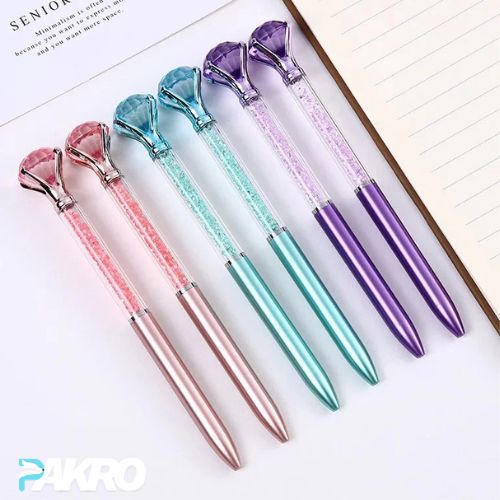 Set of colorful pens with gem-like tips on a white background