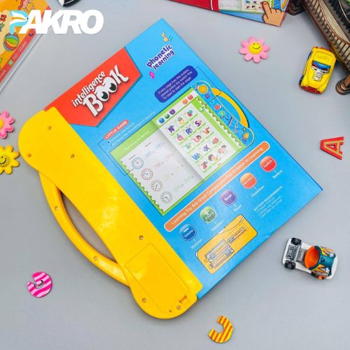 Educational toy book with colorful design on a gray surface, featuring the brand 'PAKRO'.