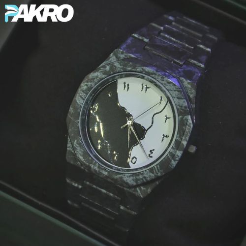 Watch with a unique design on a dark background, featuring the brand 'PAKRO'.
