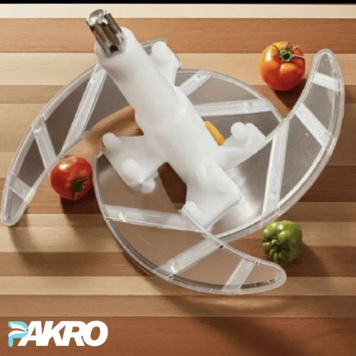 Transparent acrylic cutting board with a white plastic component on a wooden surface with tomatoes and a pepper.