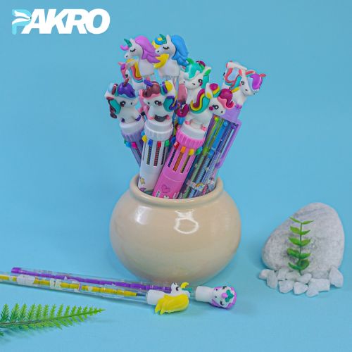 Unicorn-themed pens in a decorative holder with 'PAKRO' branding on a blue background.