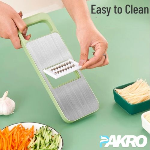 Green and silver vegetable chopper with a person using it, on a green background with 'PAKRO' branding.