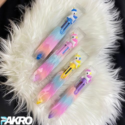 Colorful pens with cartoon characters in clear packaging on a fluffy white surface, brand 'PAKRO' visible.