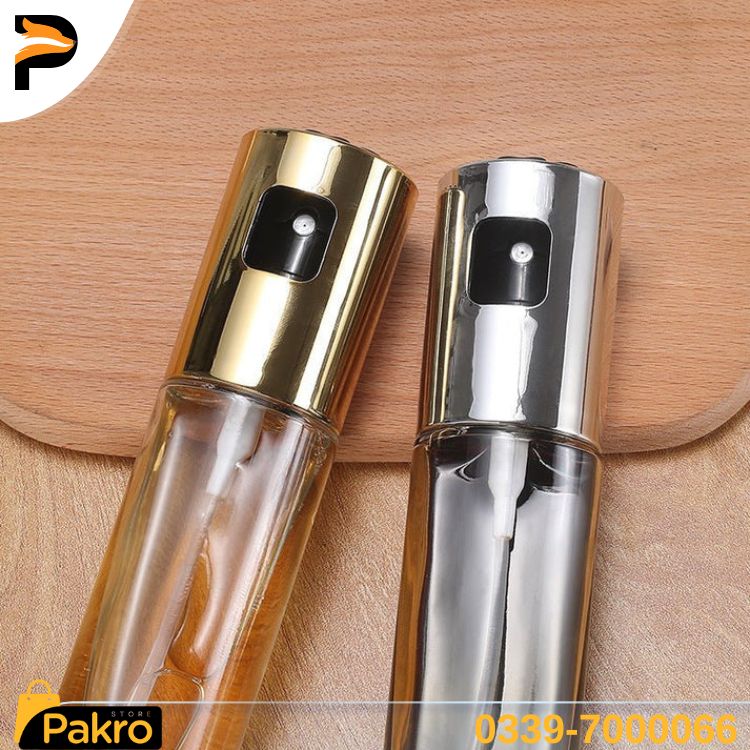 Two spray bottles, one gold and one silver, on a wooden surface with Pakro store branding.