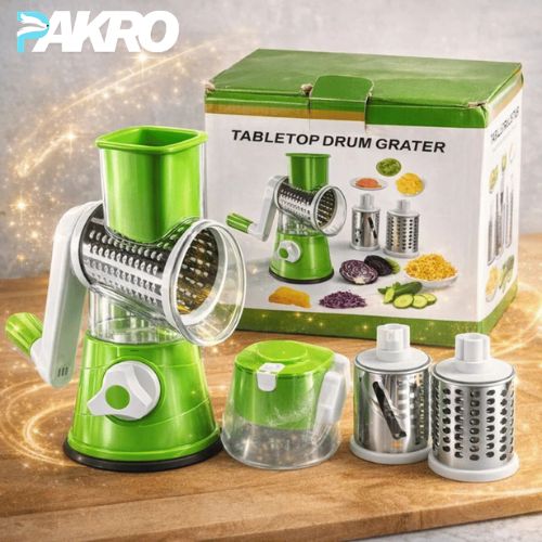 Manual 3‑in‑1 Vegetable Cutter & Drum Grater | Round Slicer,  Green tabletop drum grater with packaging on a wooden surface