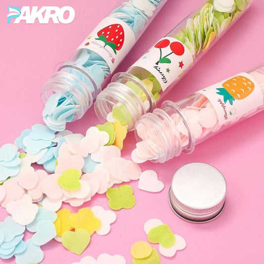 Colorful paper flower confetti in open tubes with 'PAKRO' branding on a pink background