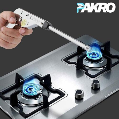 Person using a gas stove with a blue flame and a tool labeled 'PAKRO' on a dark background.