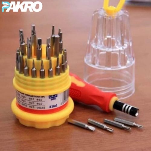 Yellow screwdriver set with multiple bits on a wooden surface, featuring the brand 'PAKRO'.