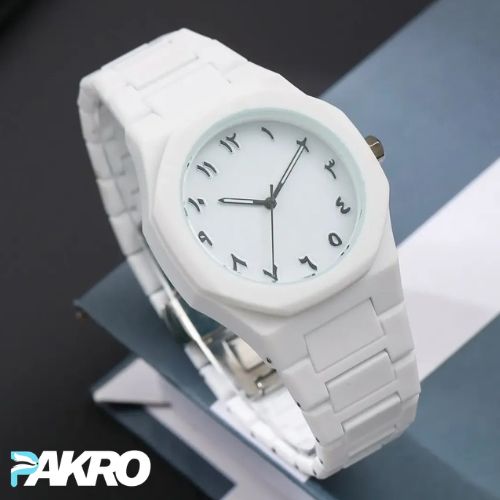 White watch with a clear face on a reflective surface, featuring the brand 'PAKRO'.