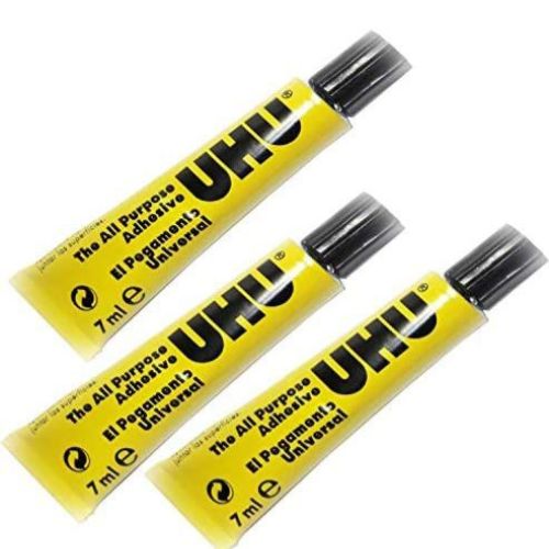 All Purpose Adhesive UHU Glue - Three yellow UHU adhesive tubes on a white background