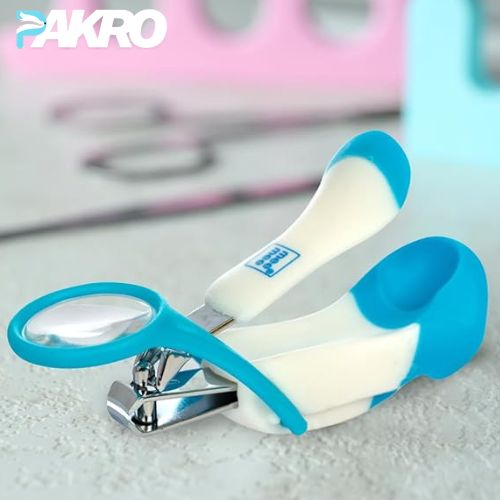 Baby Nail Clipper with Magnifier Zoom Lens, Safety Nail Cutter Blue and white nail clipper with 'PAKRO' branding on a light background