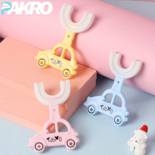 Car Style U-Shape Silicone 360 Degree Baby Toothbrush. Three colorful car-shaped toothbrushes on a pink and gray background with 'PAKRO' branding.