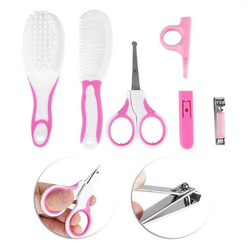Set of grooming tools including a comb, brush, scissors, and nail clippers on a white background. 6 Pcs Set Newborn Babies Healthcare Kits Baby Grooming Sets