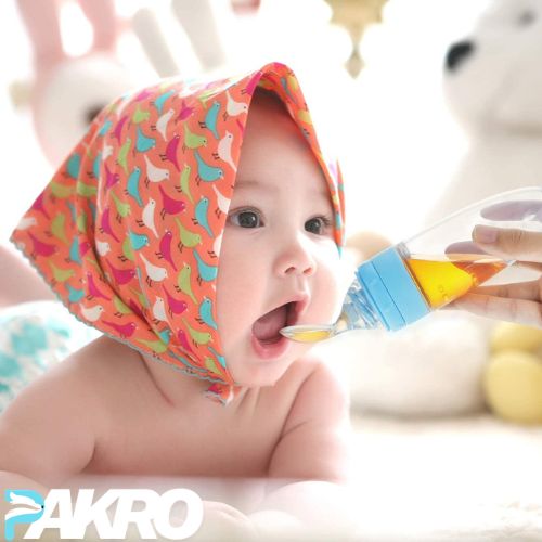 Baby wearing a colorful hat with a spoon and bottle, with 'PAKRO' branding. Silicone Baby Food Feeder for Infant Dispensing and Feeding