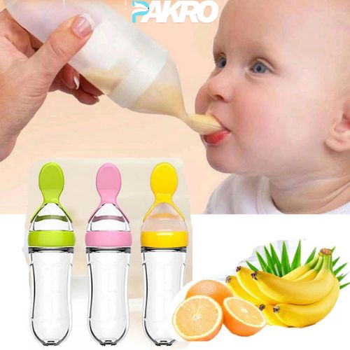 Baby being fed with a spoon, with three colorful baby bottles and fruit illustrations on a beige background. Silicone Baby Food Feeder for Infant Dispensing and Feeding